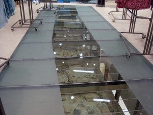 Glass and steel surround for old city wall.