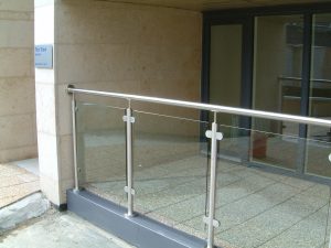 Stainless steel and glass corner balconies and railings, flashing, cladding and soffit.